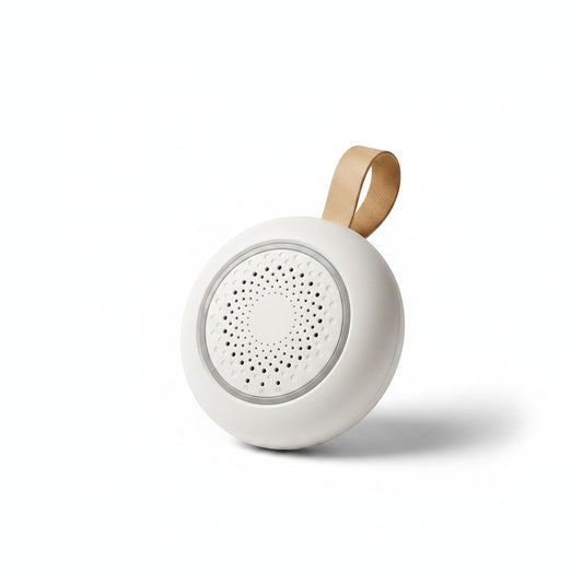 SlumberHush SoundCore baby sleep machine, white, portable with tan loop and speaker grille.