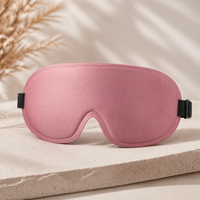 DeepShield sleep mask in soft pink with contoured blackout design on a neutral premium background