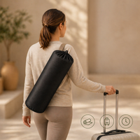 Woman carrying rolled acupressure mat in travel bag, showing portability and ease of integrating relaxation into daily routine