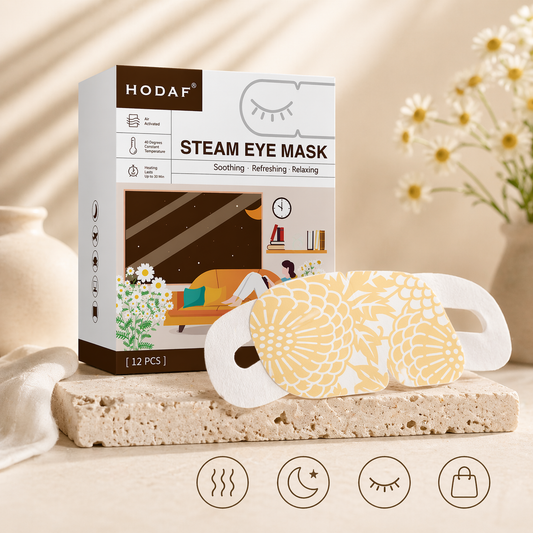 Chamomile steam eye mask with product box in soft daylight setting with flowers and minimal lifestyle elements