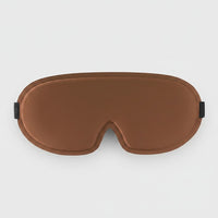 SlumberHush DeepShield sleep mask in brown, contoured for comfort and total blackout.