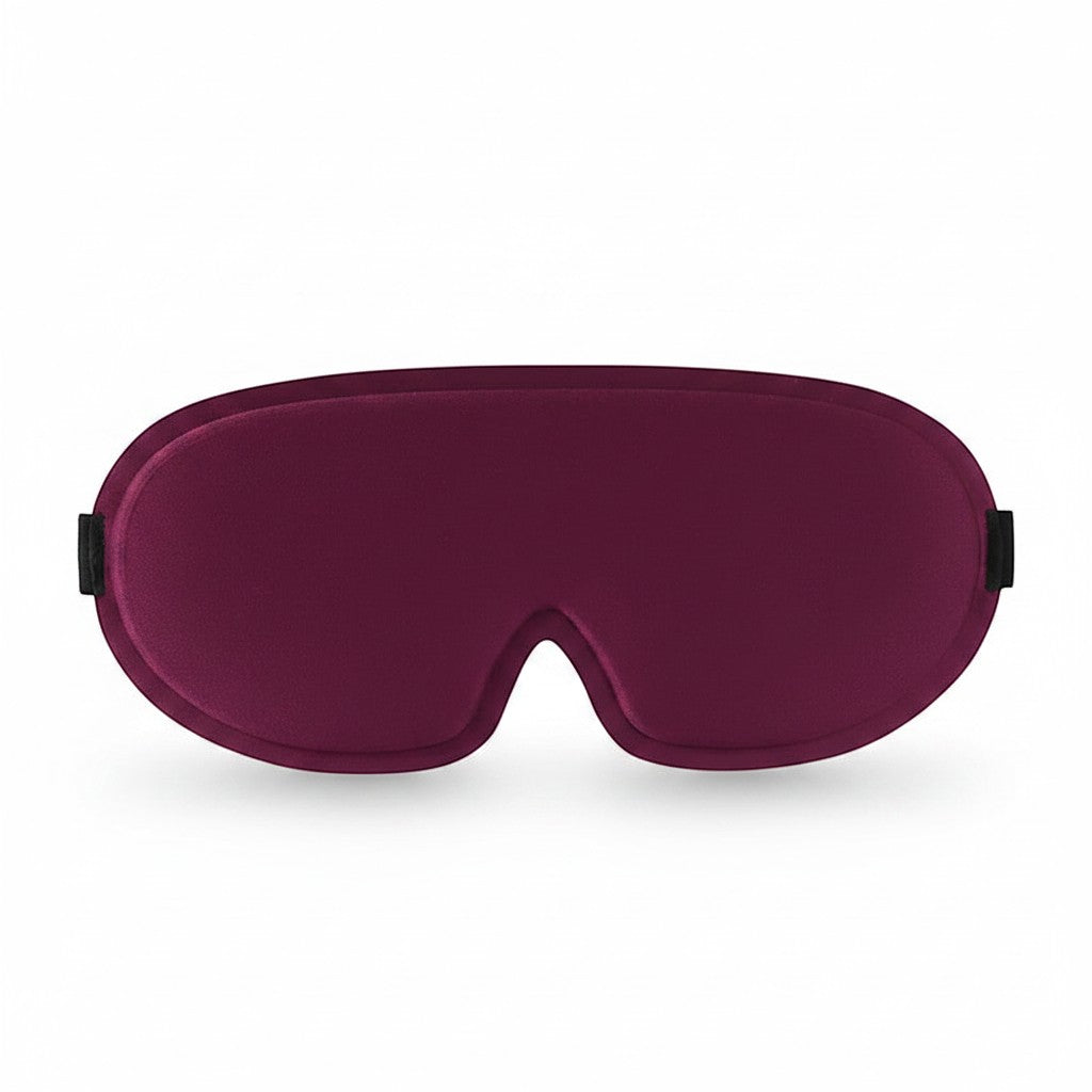 SlumberHush DeepShield sleep mask in deep plum, contoured for comfort and total blackout.