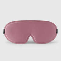 SlumberHush DeepShield sleep mask in dusty rose, contoured for comfort and light blocking.