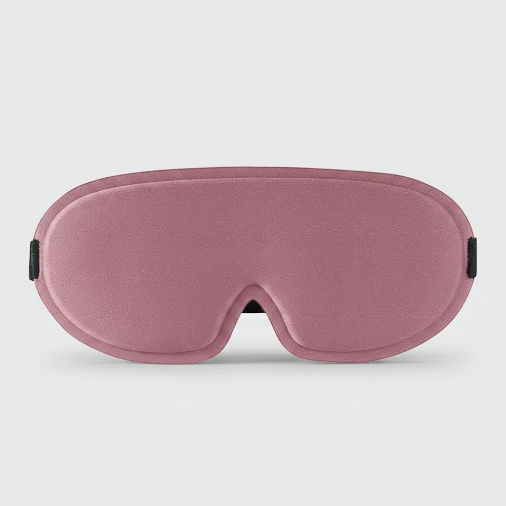 SlumberHush DeepShield sleep mask in dusty rose, contoured for comfort and total blackout.