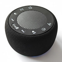 SlumberHush Pro Sleep Machine, black fabric portable speaker with top control panel for sound and timer functions.
