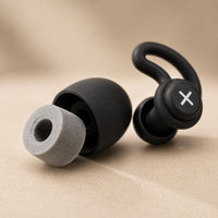 SlumberHush QuietSeal earplugs with foam tips and ear hooks. Black and grey.
