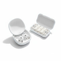 SlumberHush QuietSeal earplugs in white silicone, with charging case and extra ear tips. Designed for sleep.