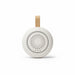 SlumberHush SoundCore baby sleep machine, white with tan loop, circular speaker grille.