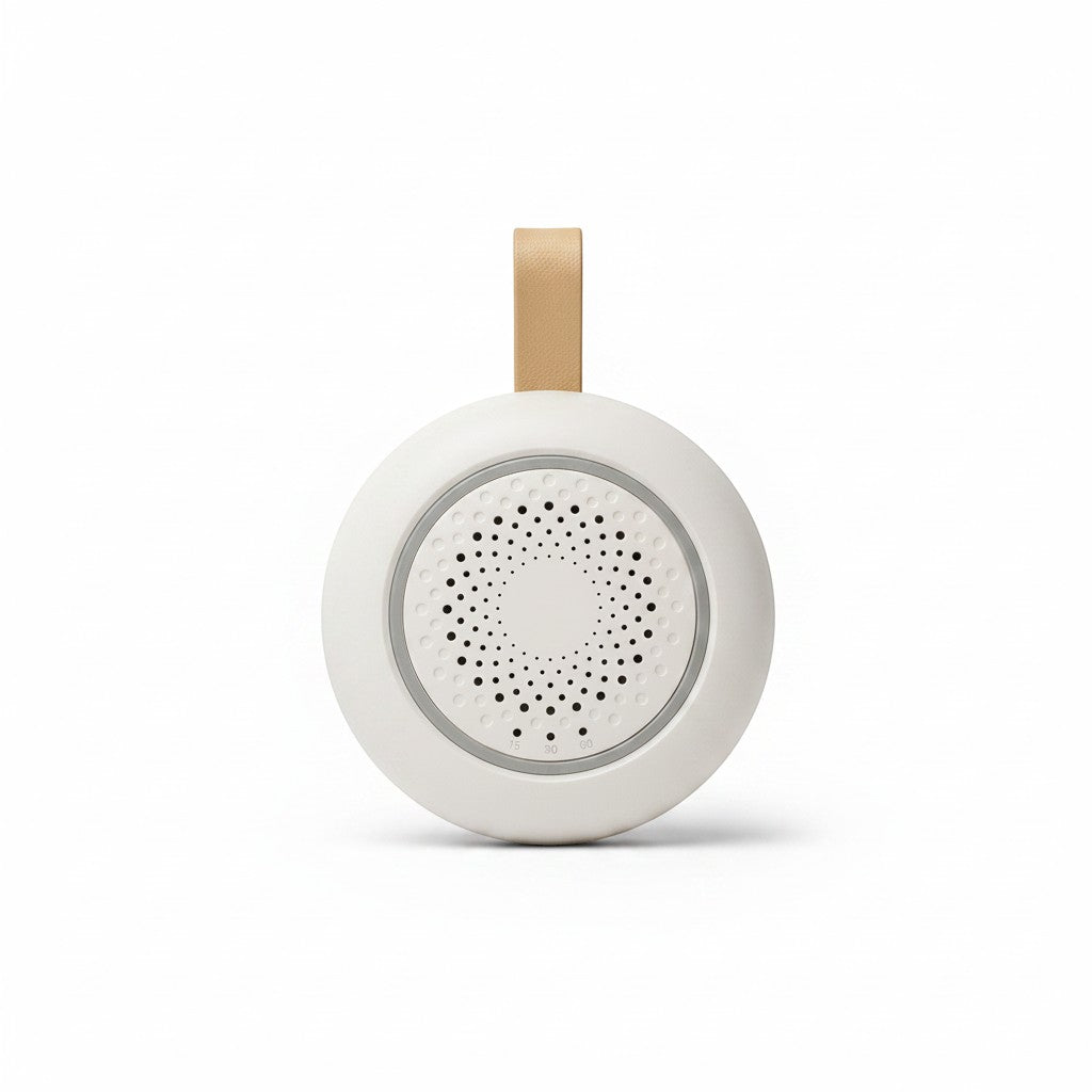 SlumberHush SoundCore baby sleep machine, white with tan loop, circular speaker grille.