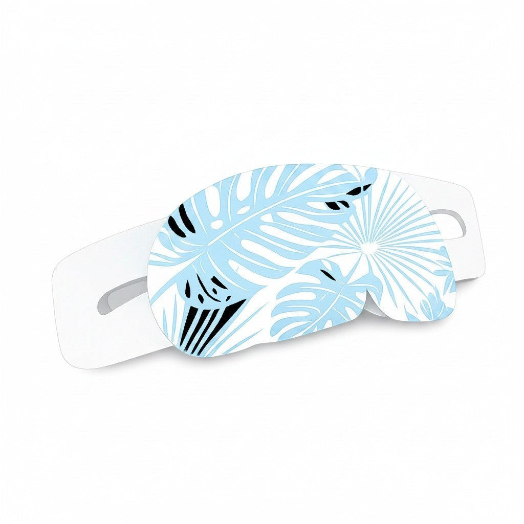 SlumberHush WarmEye steam mask with a blue tropical leaf print and white ear loops for relaxation.