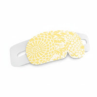 SlumberHush WarmEye steam mask with yellow floral pattern and white elastic strap